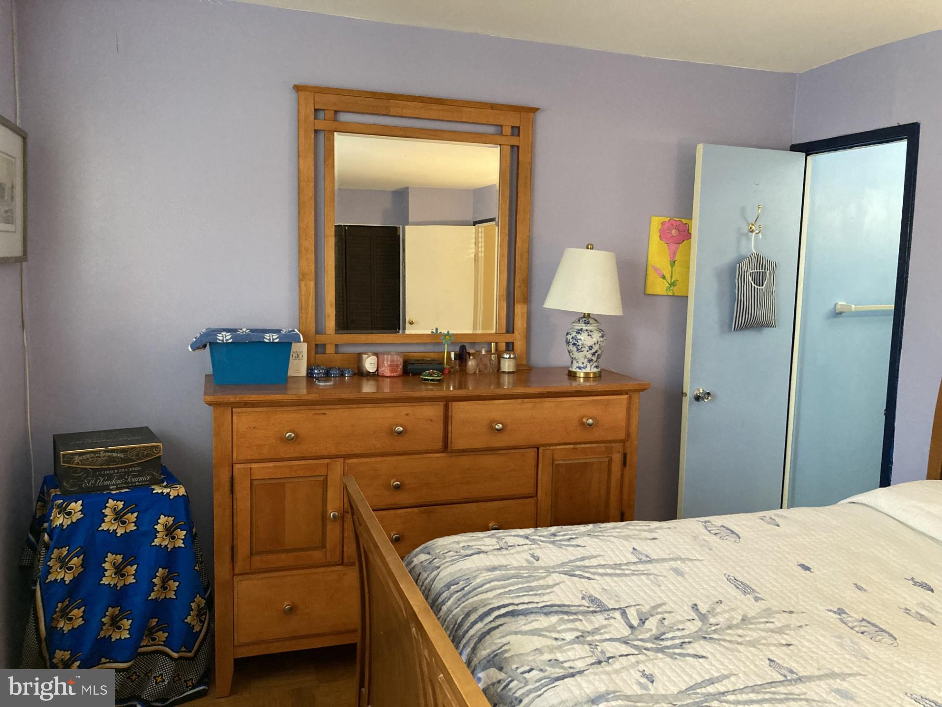 2310 Sun Valley Circle, Unit 1D Silver Spring, MD 20906 - Photo 13 of 20 a bedroom with a bed and a dresser in it