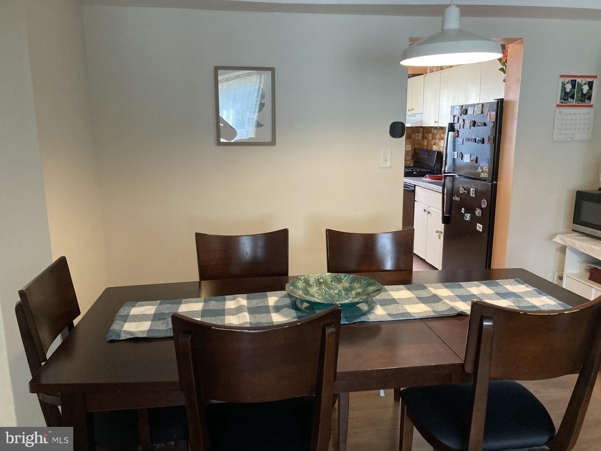 2310 Sun Valley Circle, Unit 1D Silver Spring, MD 20906 - Photo 6 of 20 a view of a dining room with furniture