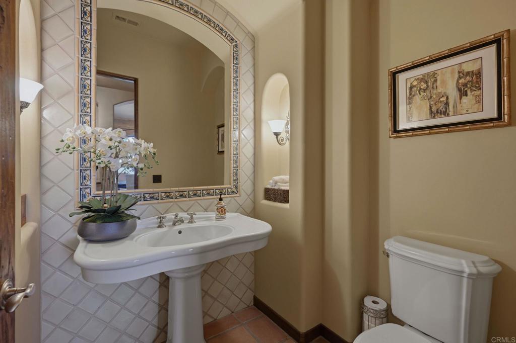 3244 Olivenhain Farms Road Encinitas, CA 92024 - Photo 13 of 47 a bathroom with a sink and a mirror with toilet
