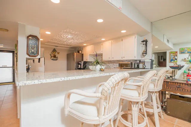 a table and chairs in front of a house