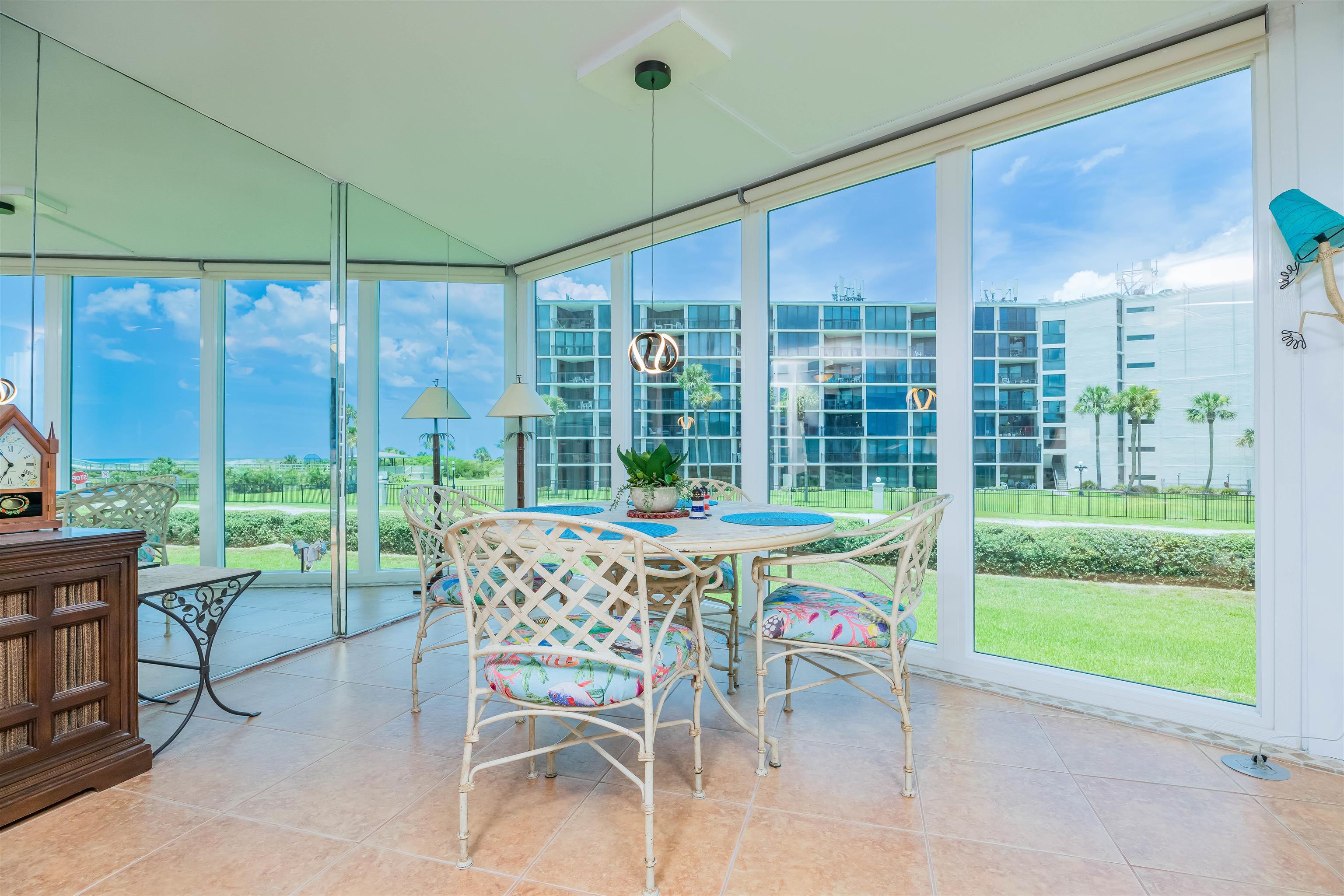 1 Dondanville Road, Unit 116C St. Augustine, FL 32080 - Photo 19 of 59 a table and chairs in front of a house