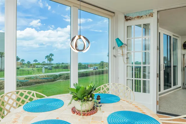 a view of a swimming pool with a yard