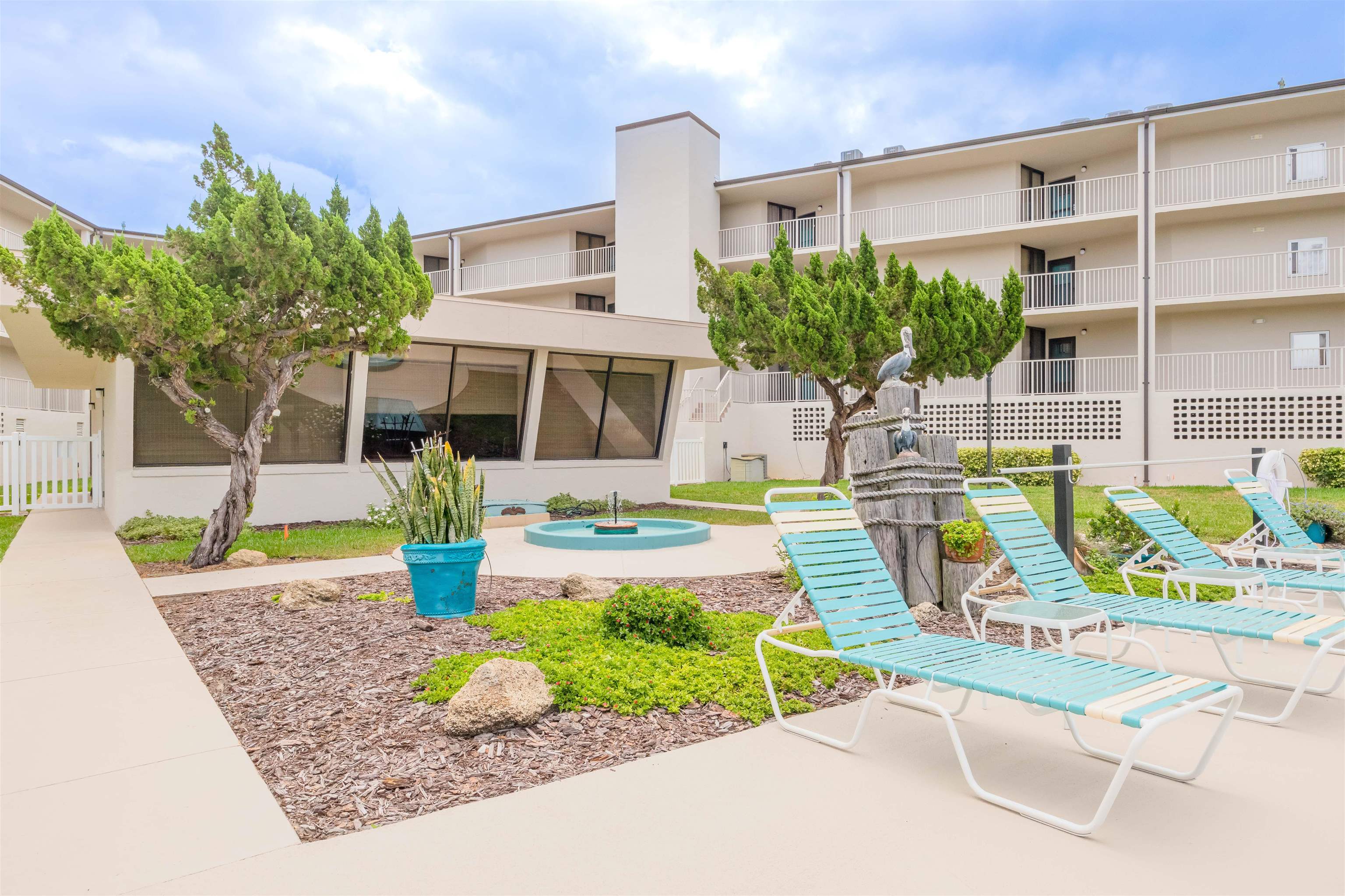 1 Dondanville Road, Unit 116C St. Augustine, FL 32080 - Photo 41 of 59 a front view of a house with garden