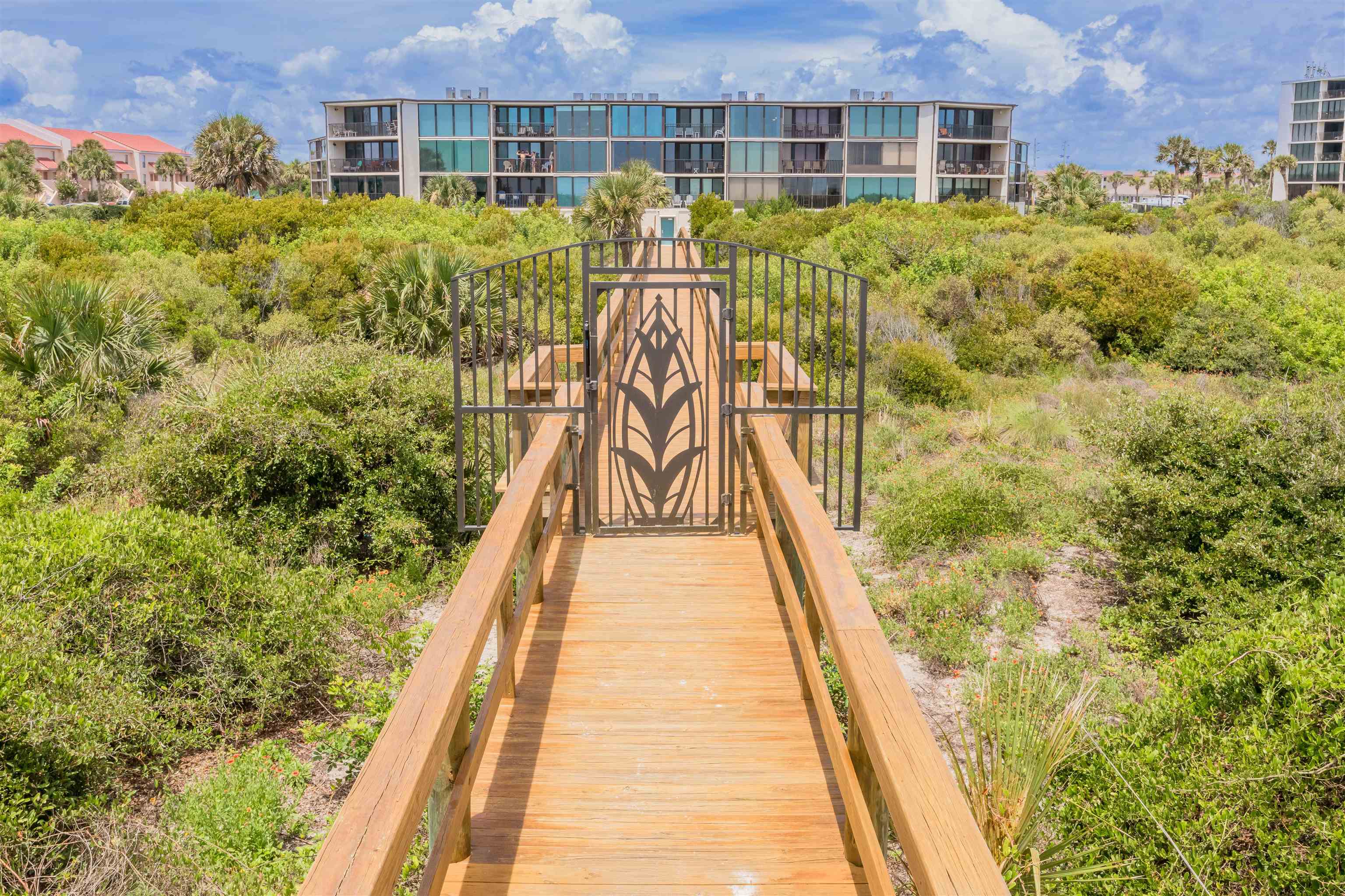 1 Dondanville Road, Unit 116C St. Augustine, FL 32080 - Photo 51 of 59 a view of a brick building next to a yard