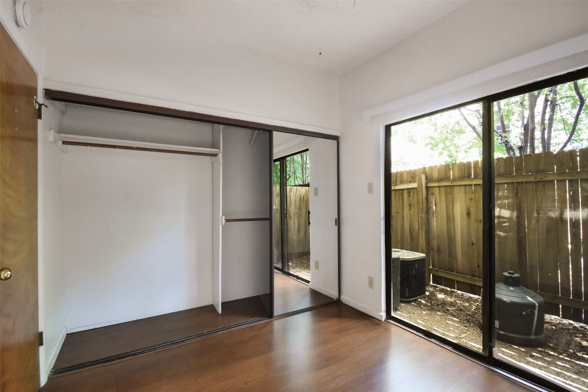 2815 Rio Grande Street, Unit 109 Austin, TX 78705 - Photo 13 of 20 a view of a room with wooden floor and windows