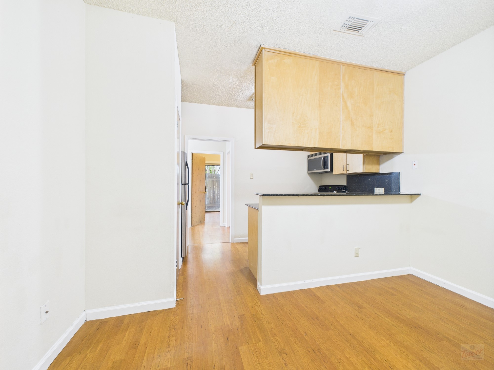 2815 Rio Grande Street, Unit 109 Austin, TX 78705 - Photo 6 of 25 a view of front door with wooden floor