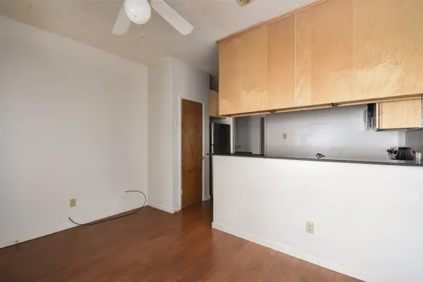 a kitchen with a sink and a refrigerator
