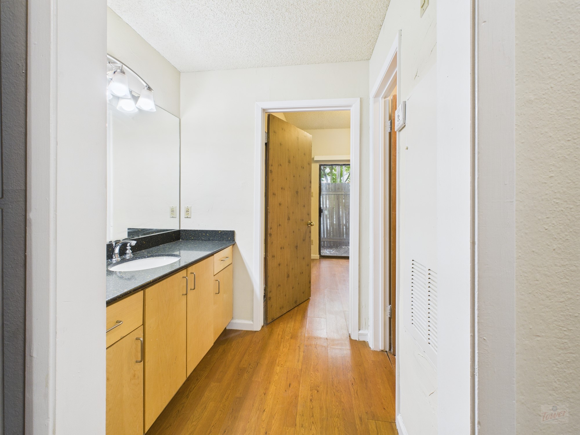 2815 Rio Grande Street, Unit 109 Austin, TX 78705 - Photo 8 of 25 a view of a bathroom from a hallway