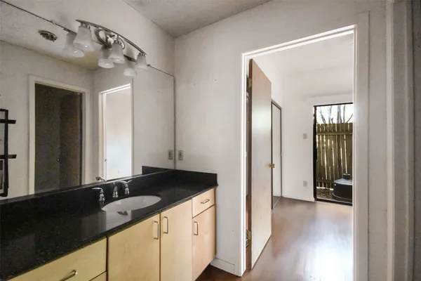 a bathroom with a bathtub and a toilet