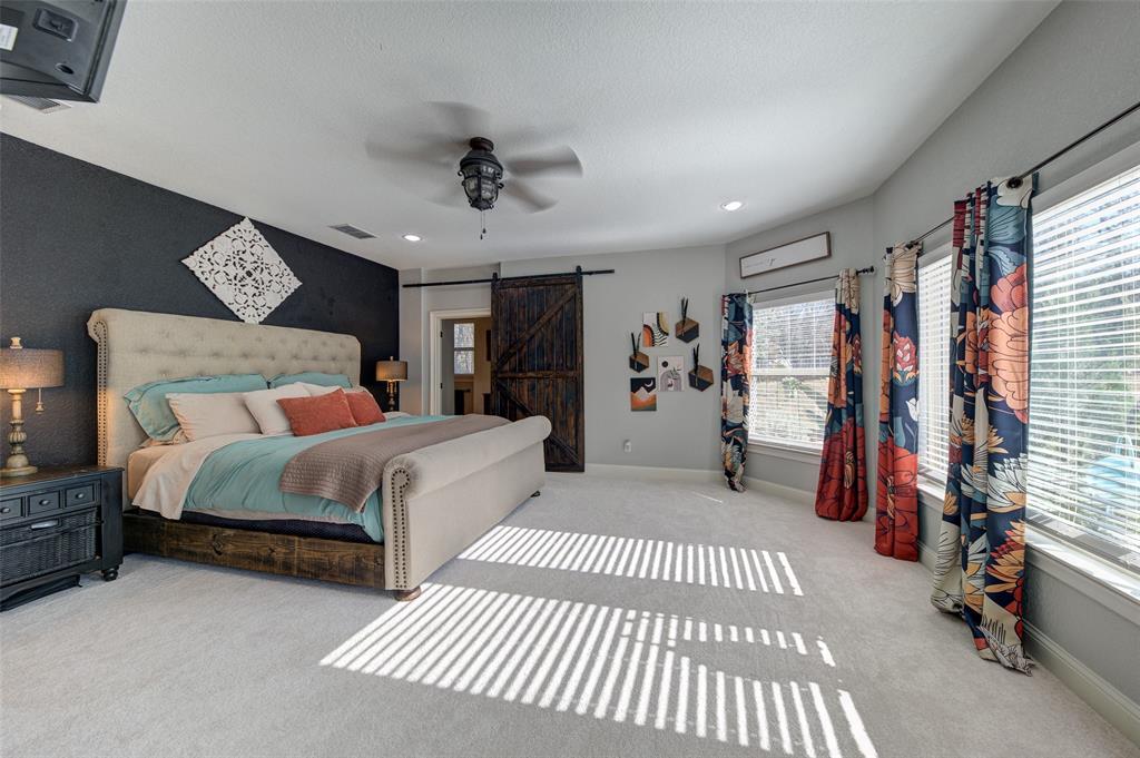 9199 Fm 1810 Chico, TX 76431 - Photo 12 of 40 a bedroom with a bed and a walk in closet
