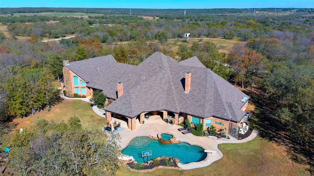 9199 Fm 1810 Chico, TX 76431 - Photo 2 of 40 an aerial view of a house with a yard