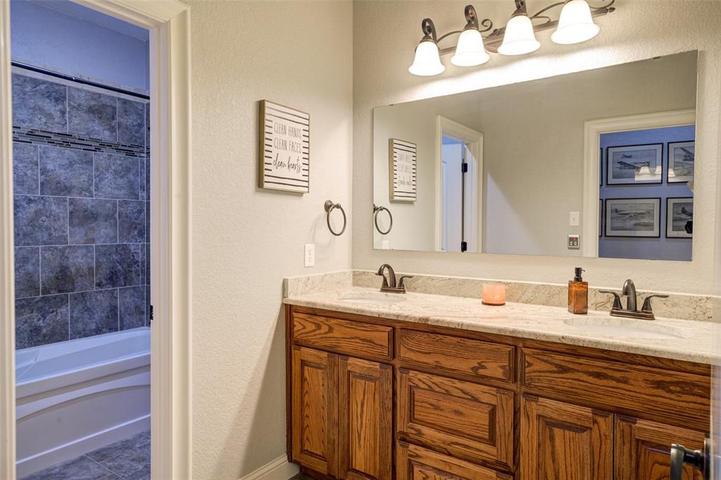9199 Fm 1810 Chico, TX 76431 - Photo 21 of 40 a bathroom with a sink and a mirror