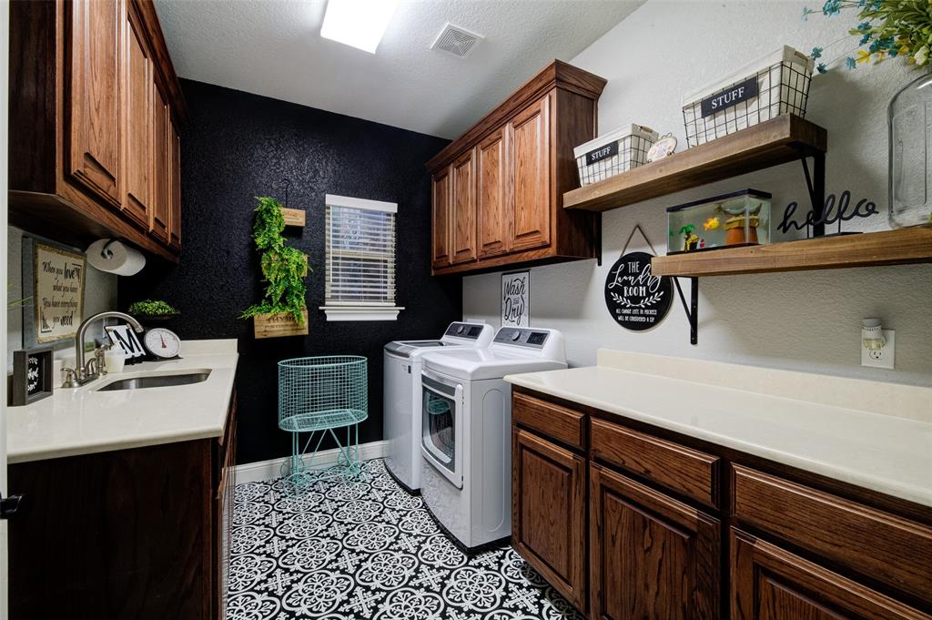 9199 Fm 1810 Chico, TX 76431 - Photo 24 of 40 a kitchen with a sink a stove and cabinets