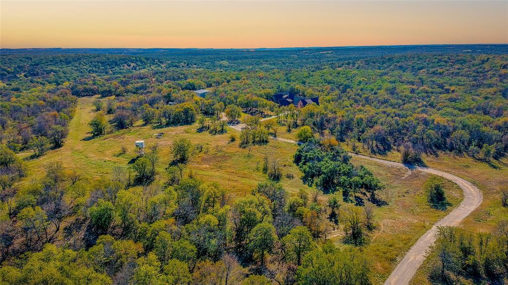 9199 Fm 1810 Chico, TX 76431 - Photo 40 of 40 an aerial view of residential houses with outdoor space and trees