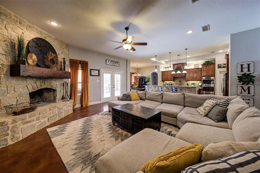 9199 Fm 1810 Chico, TX 76431 - Photo 8 of 40 a living room with furniture and a fireplace