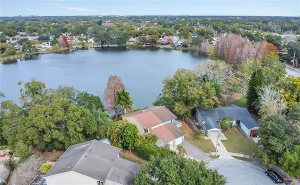 an aerial view of a house with a lake view