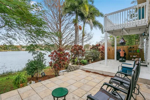 a view of a patio with table and chairs and potted plants