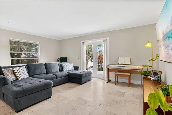 a living room with furniture and a window