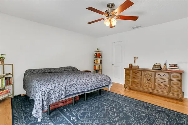 a bedroom with a bed and cabinets