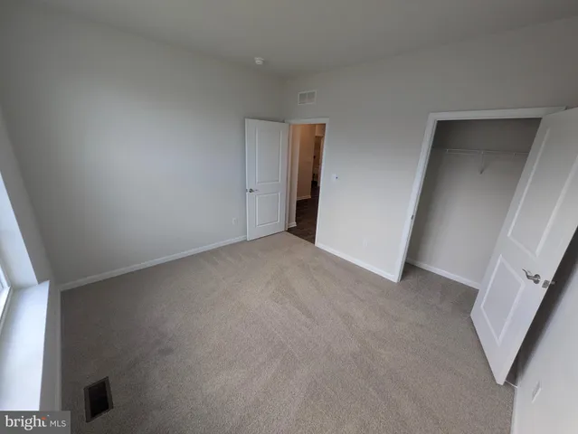 a white toilet sitting next to a bath tub