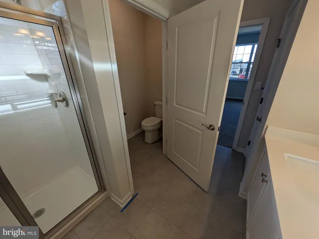a spacious bathroom with a double vanity sink and a mirror