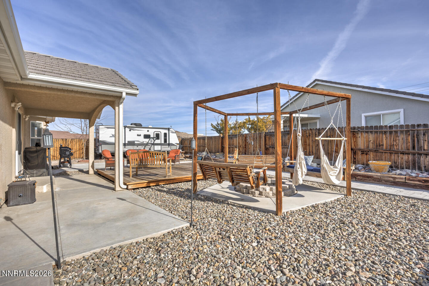 440 Cornerstone Court Fallon, NV 89406 - Photo 24 of 31 a view of a hall with a dining table and chairs