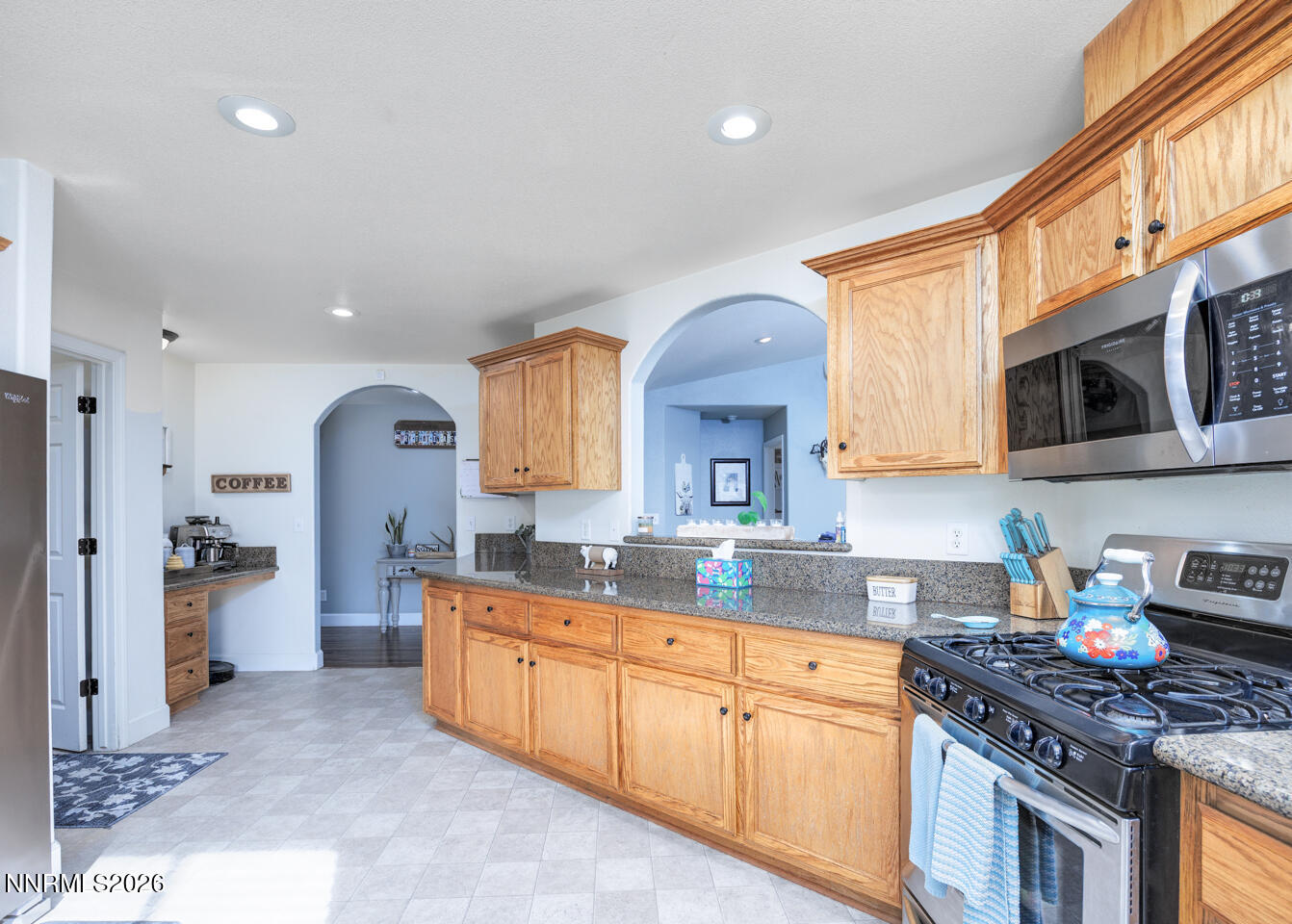 440 Cornerstone Court Fallon, NV 89406 - Photo 8 of 31 a kitchen with stainless steel appliances granite countertop a stove a sink dishwasher and a refrigerator