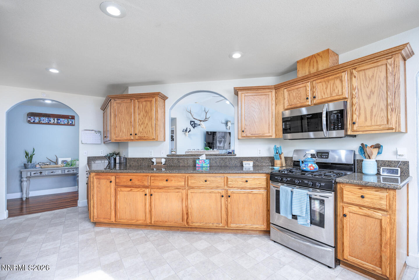 440 Cornerstone Court Fallon, NV 89406 - Photo 10 of 31 a kitchen with stainless steel appliances granite countertop a stove sink and microwave
