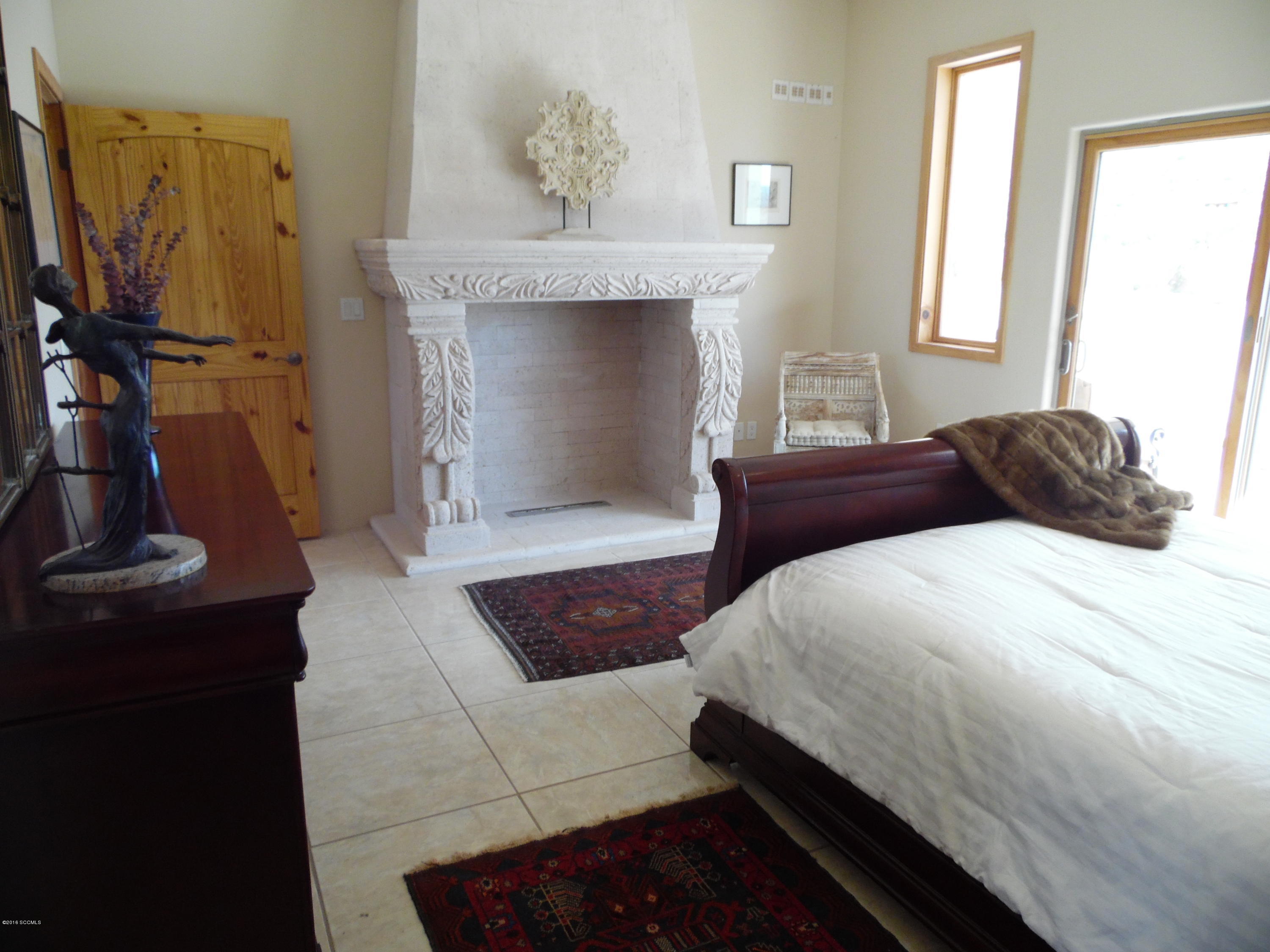 173 Camino Embarcadero Rio Rico, AZ 85648 - Photo 26 of 38 a bedroom with a bed and a window