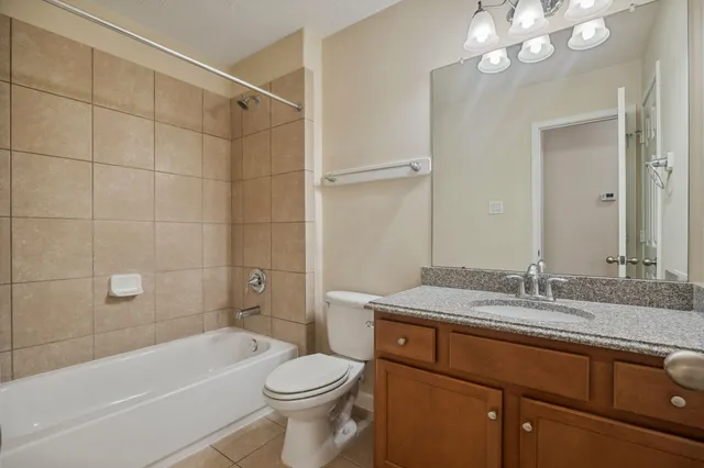 a bathroom with a sink a toilet and bathtub