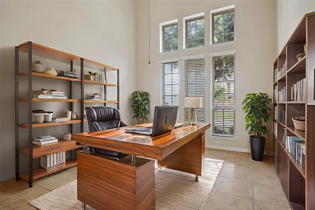 a work place with furniture and book shelf