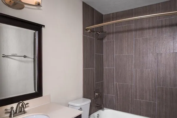 a bathroom with a shower curtain and a sink