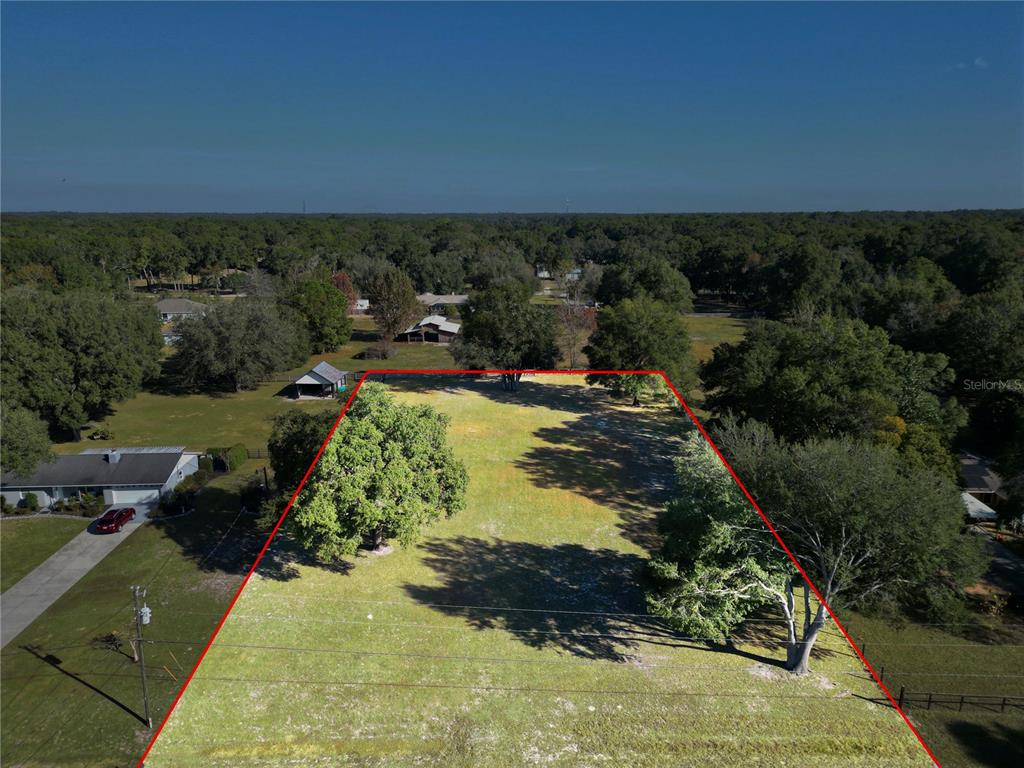 2975 Southeast 159th Lane Road Summerfield, FL 34491 - Photo 1 of 6 an aerial view of residential houses with outdoor space