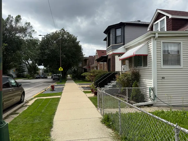 a swimming pool with some trees in the background