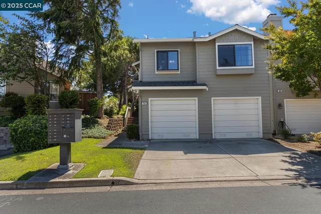 a view of backyard of house and entertaining space