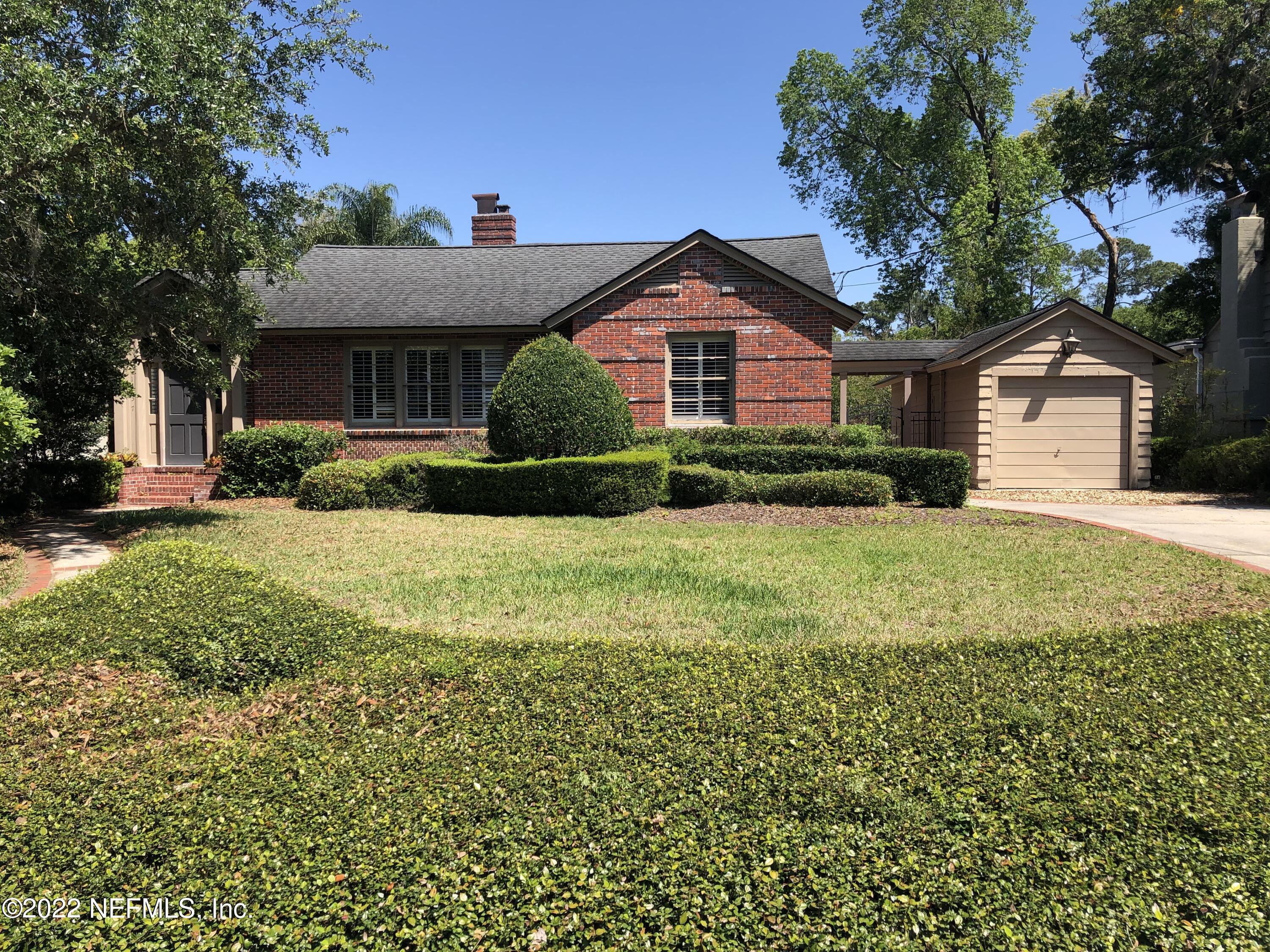 1237 Greenridge Road Jacksonville, FL 32207 - Photo 1 of 9 a front view of a house with a yard