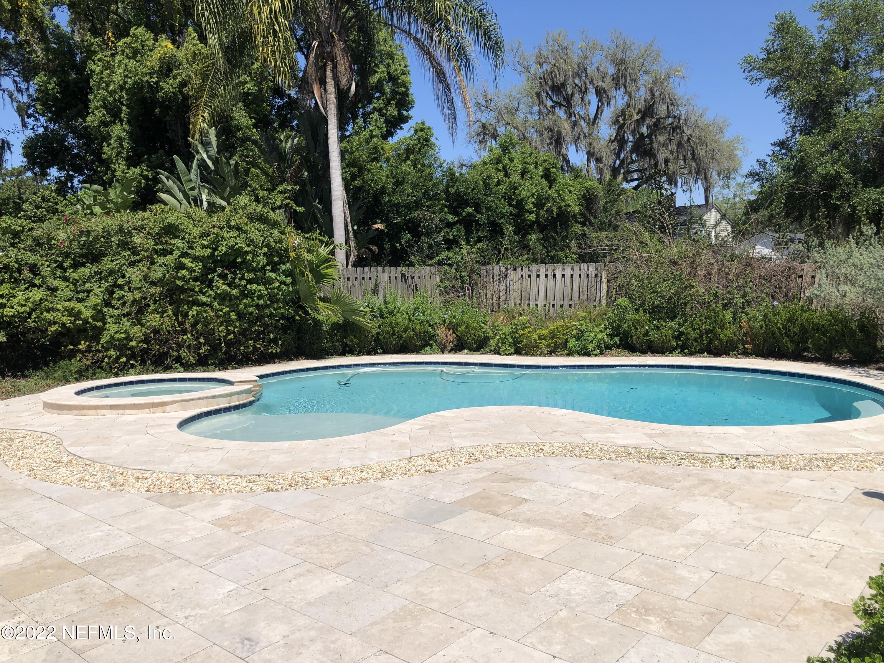 1237 Greenridge Road Jacksonville, FL 32207 - Photo 2 of 9 a view of a swimming pool with a yard
