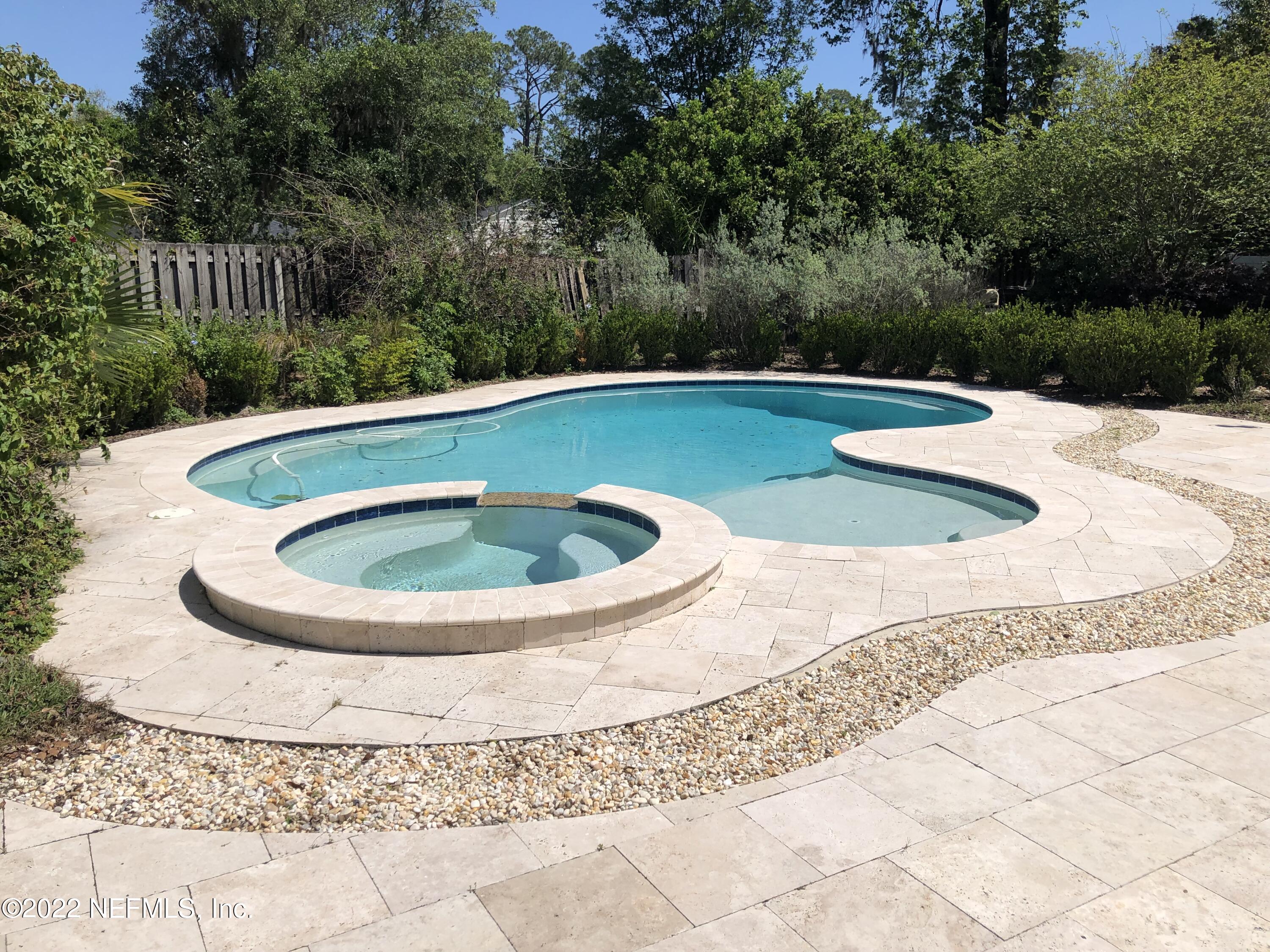 1237 Greenridge Road Jacksonville, FL 32207 - Photo 3 of 9 a view of a swimming pool with a yard