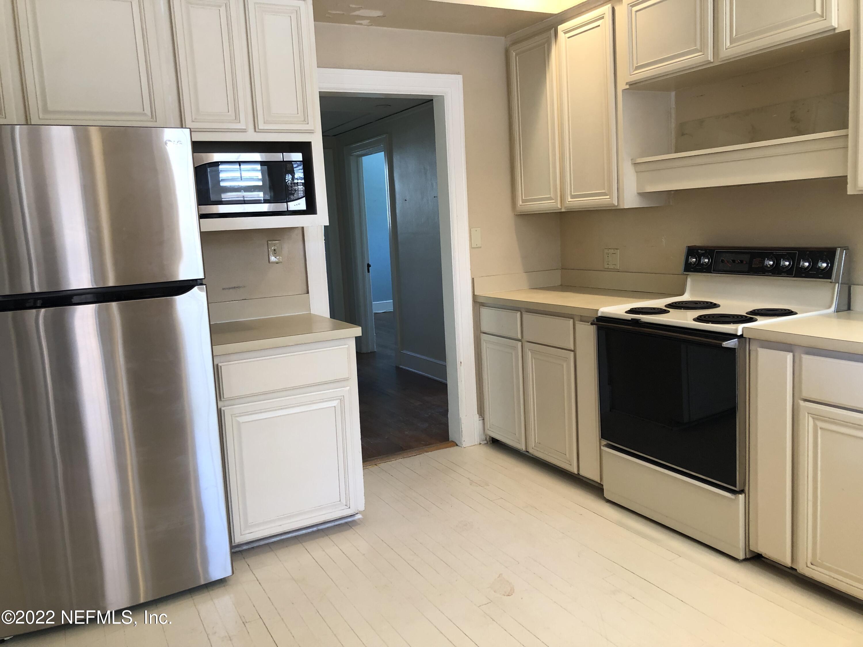 1237 Greenridge Road Jacksonville, FL 32207 - Photo 5 of 9 a kitchen with a refrigerator sink and stove