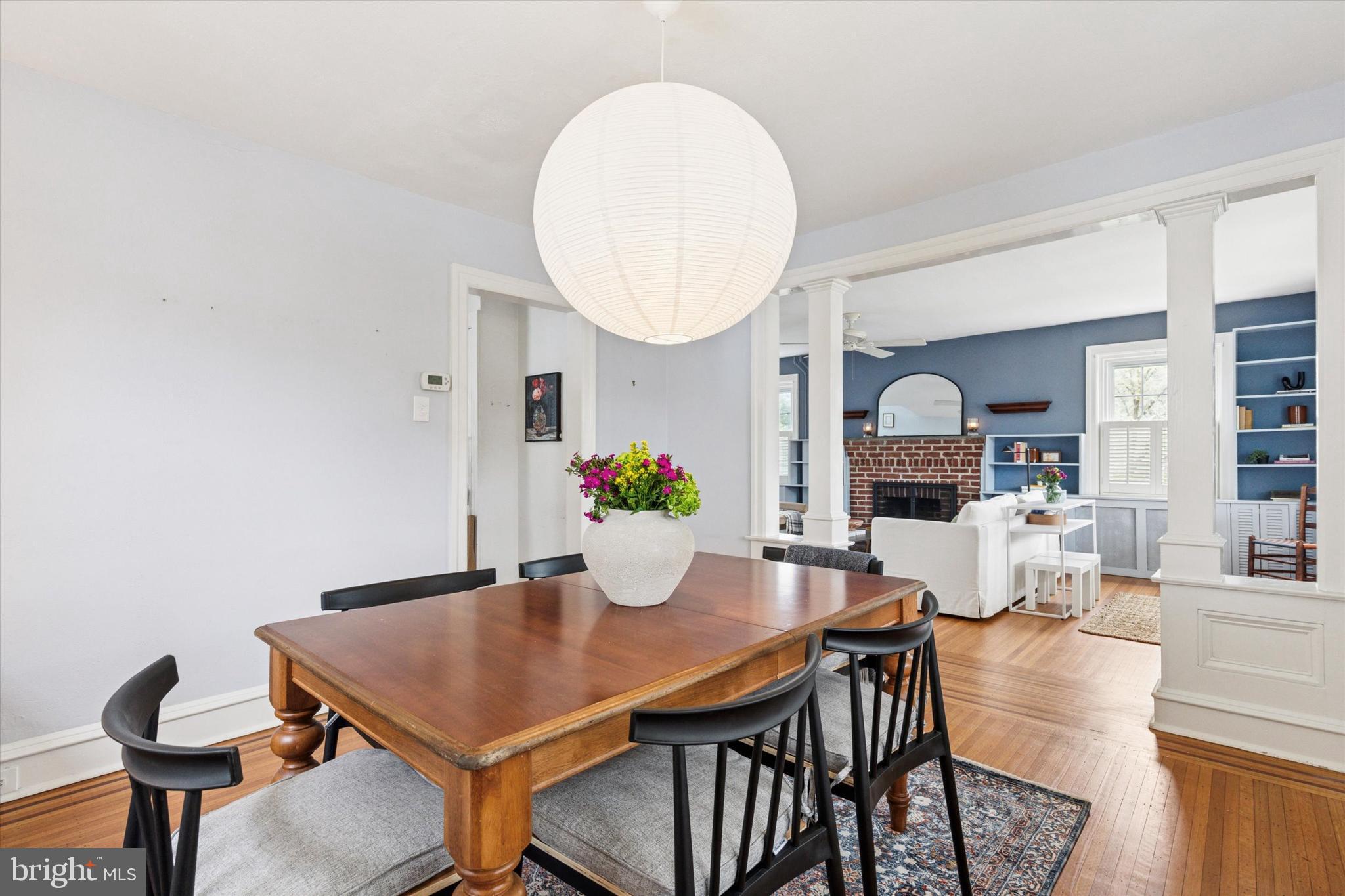 208 Sabine Avenue Narberth, PA 19072 - Photo 13 of 38 a view of a dining room with furniture and a potted plant