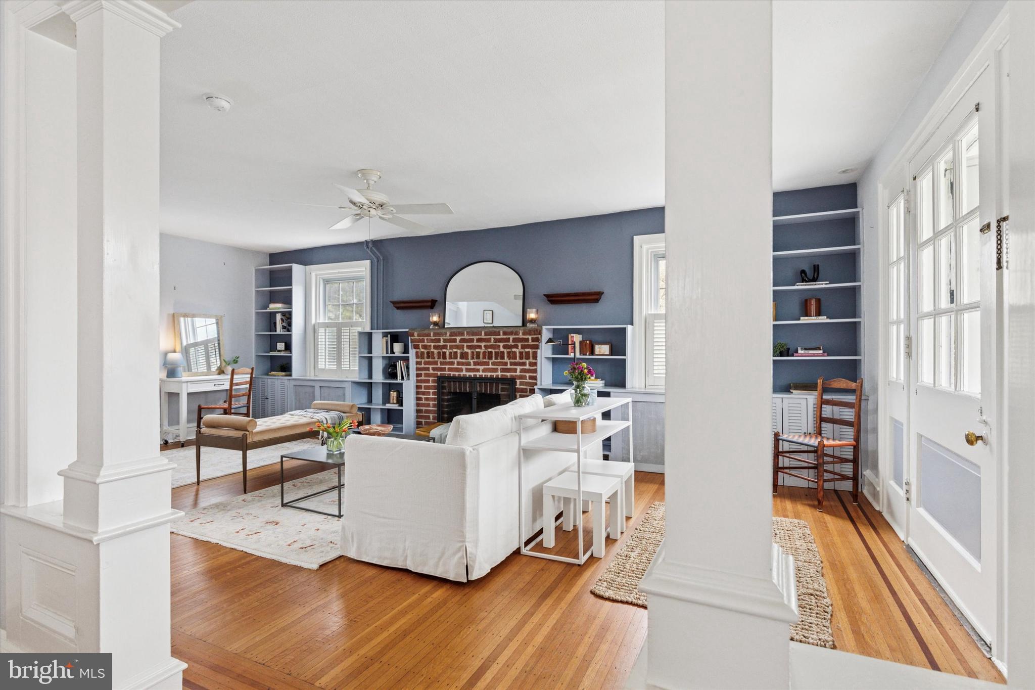 208 Sabine Avenue Narberth, PA 19072 - Photo 14 of 38 a living room with furniture and a fireplace