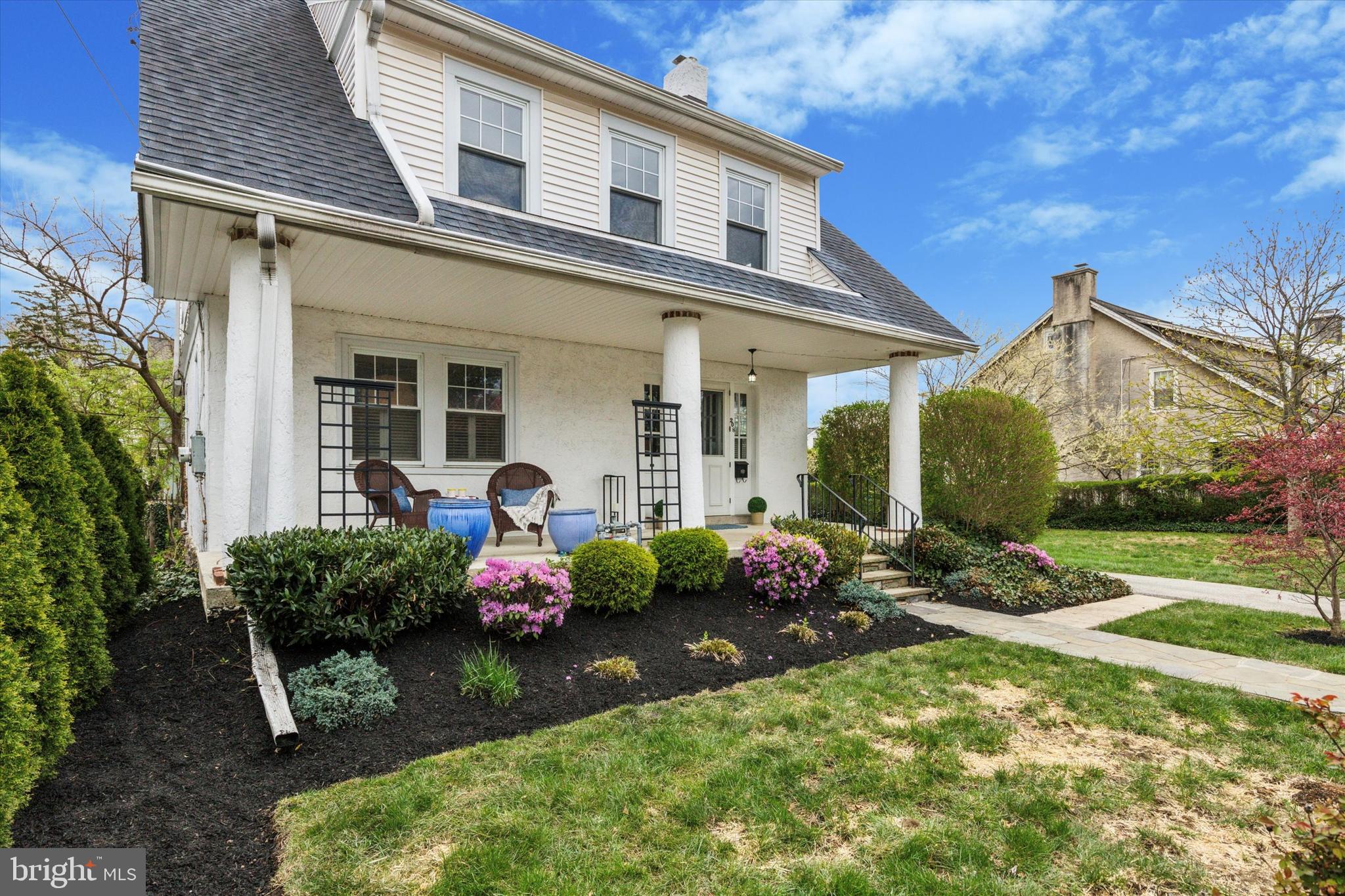 208 Sabine Avenue Narberth, PA 19072 - Photo 2 of 38 a front view of a house with garden