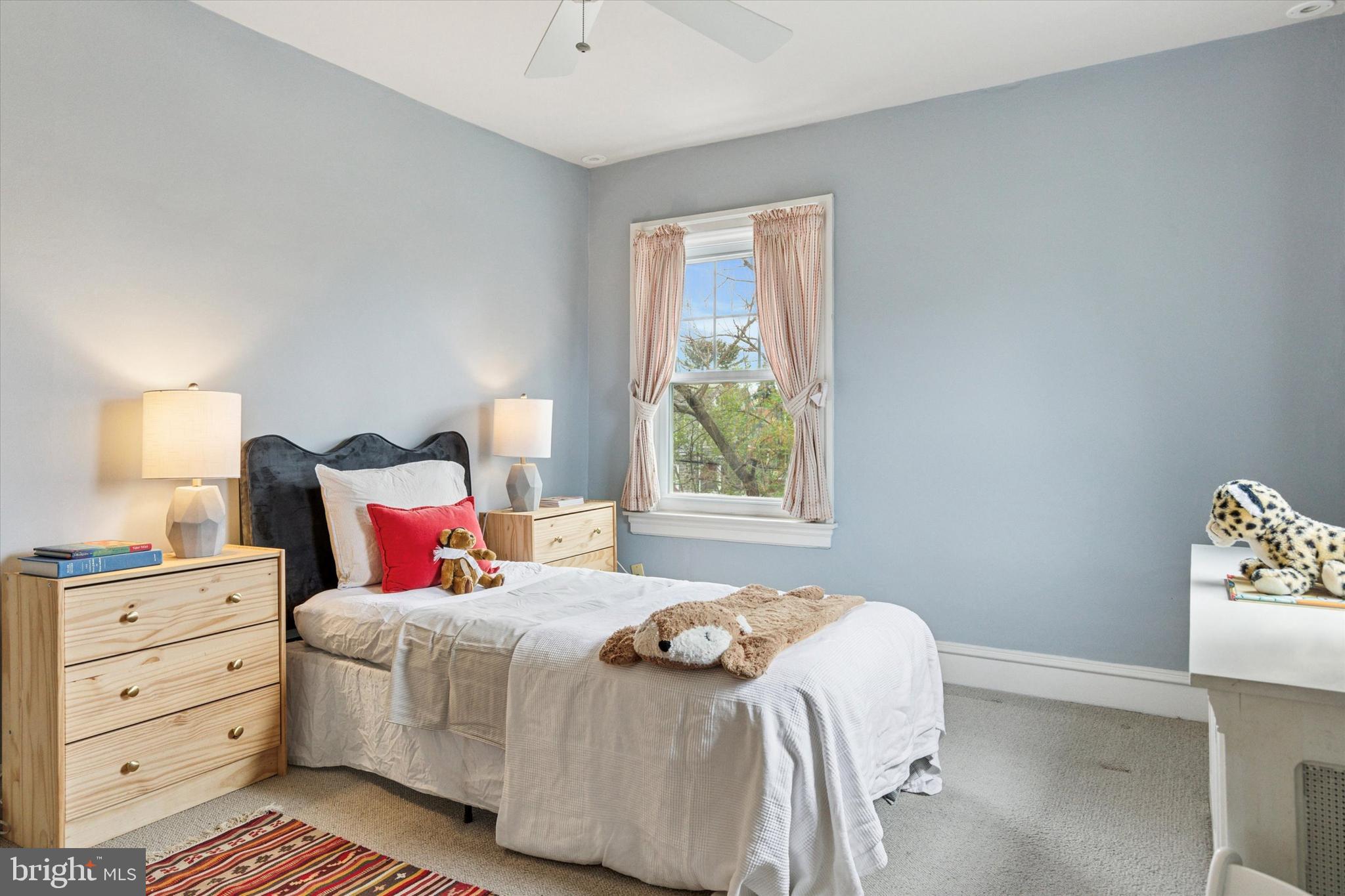 208 Sabine Avenue Narberth, PA 19072 - Photo 23 of 38 a bedroom with a bed and a window