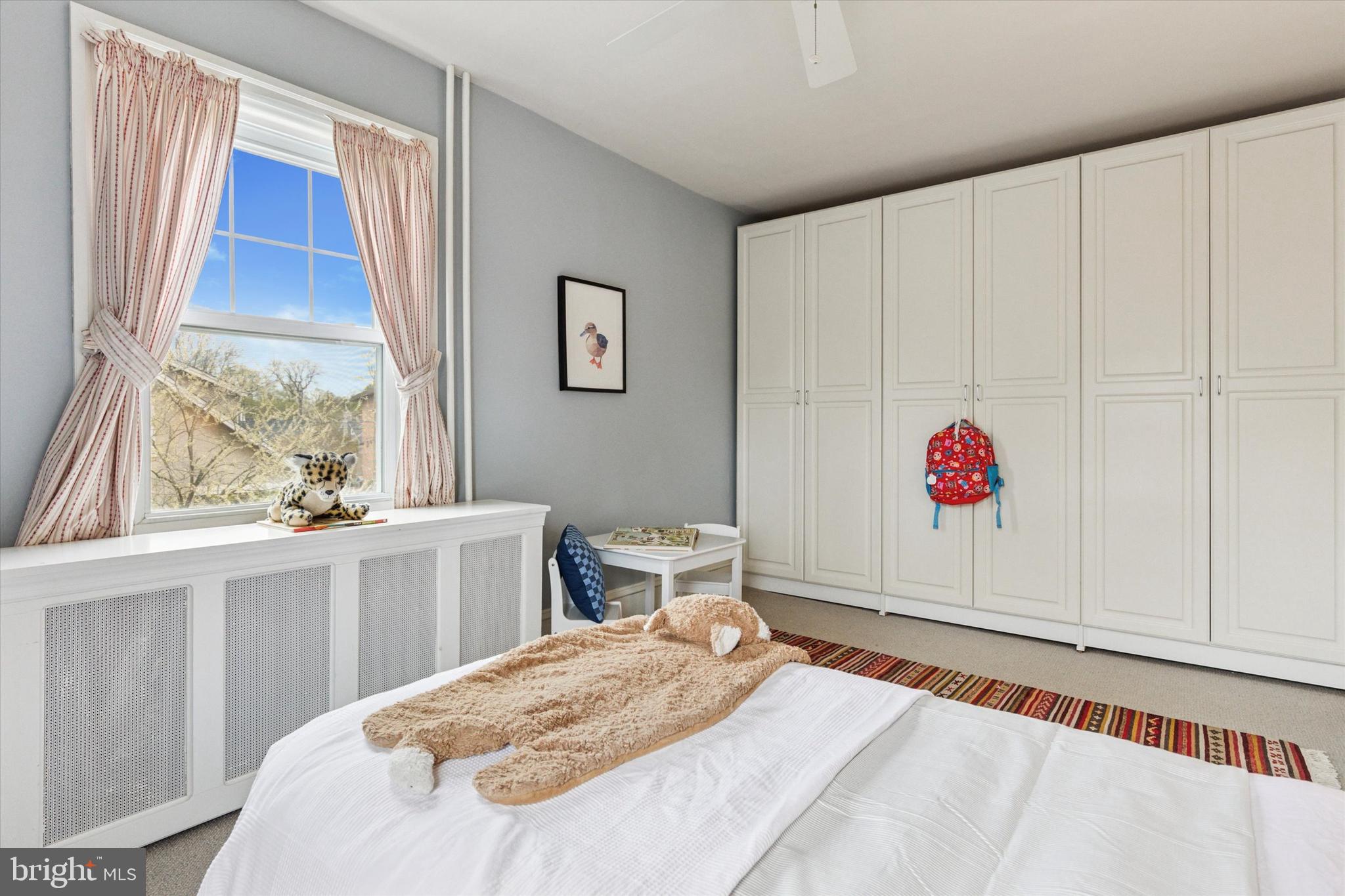 208 Sabine Avenue Narberth, PA 19072 - Photo 24 of 38 a bed room with a bed and a window