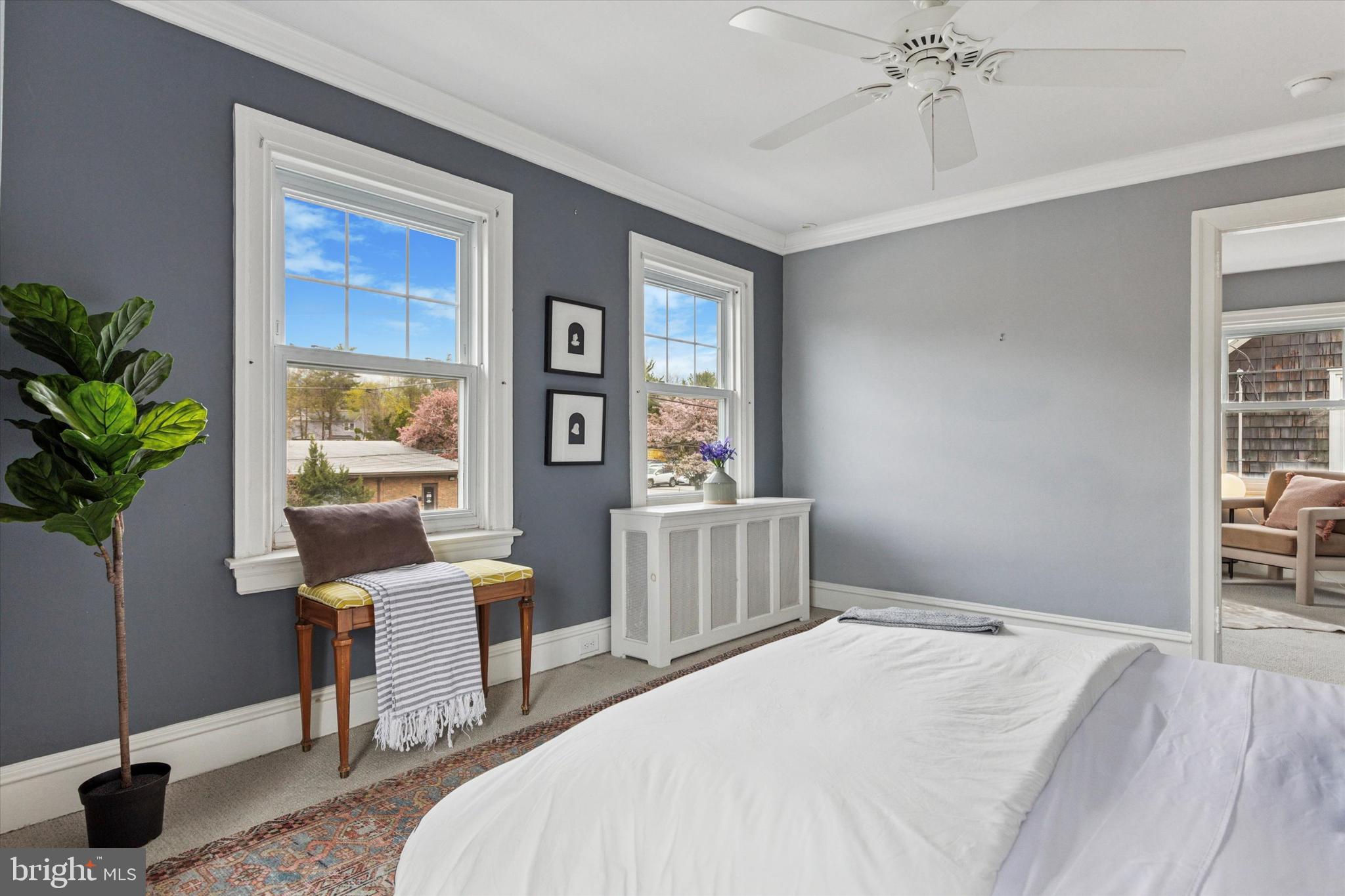 208 Sabine Avenue Narberth, PA 19072 - Photo 27 of 38 a bedroom with a bed and a table in it