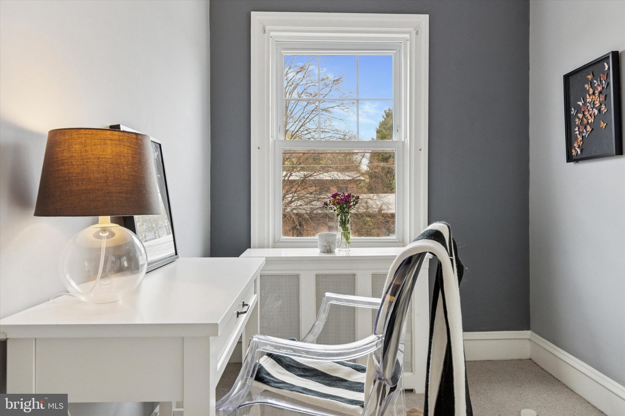 208 Sabine Avenue Narberth, PA 19072 - Photo 30 of 38 a dining room with a large window and table