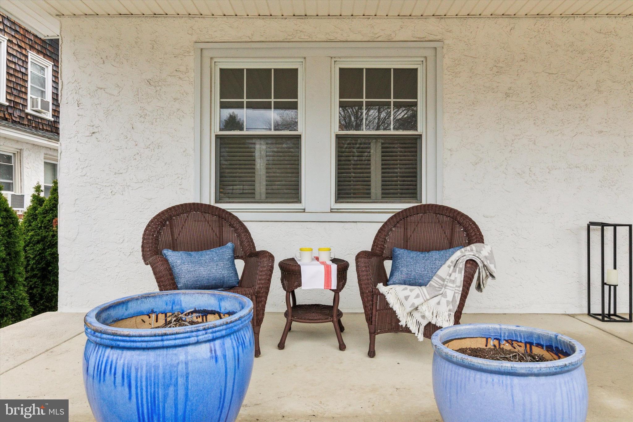 208 Sabine Avenue Narberth, PA 19072 - Photo 6 of 38 a living room with furniture a rug and a chair