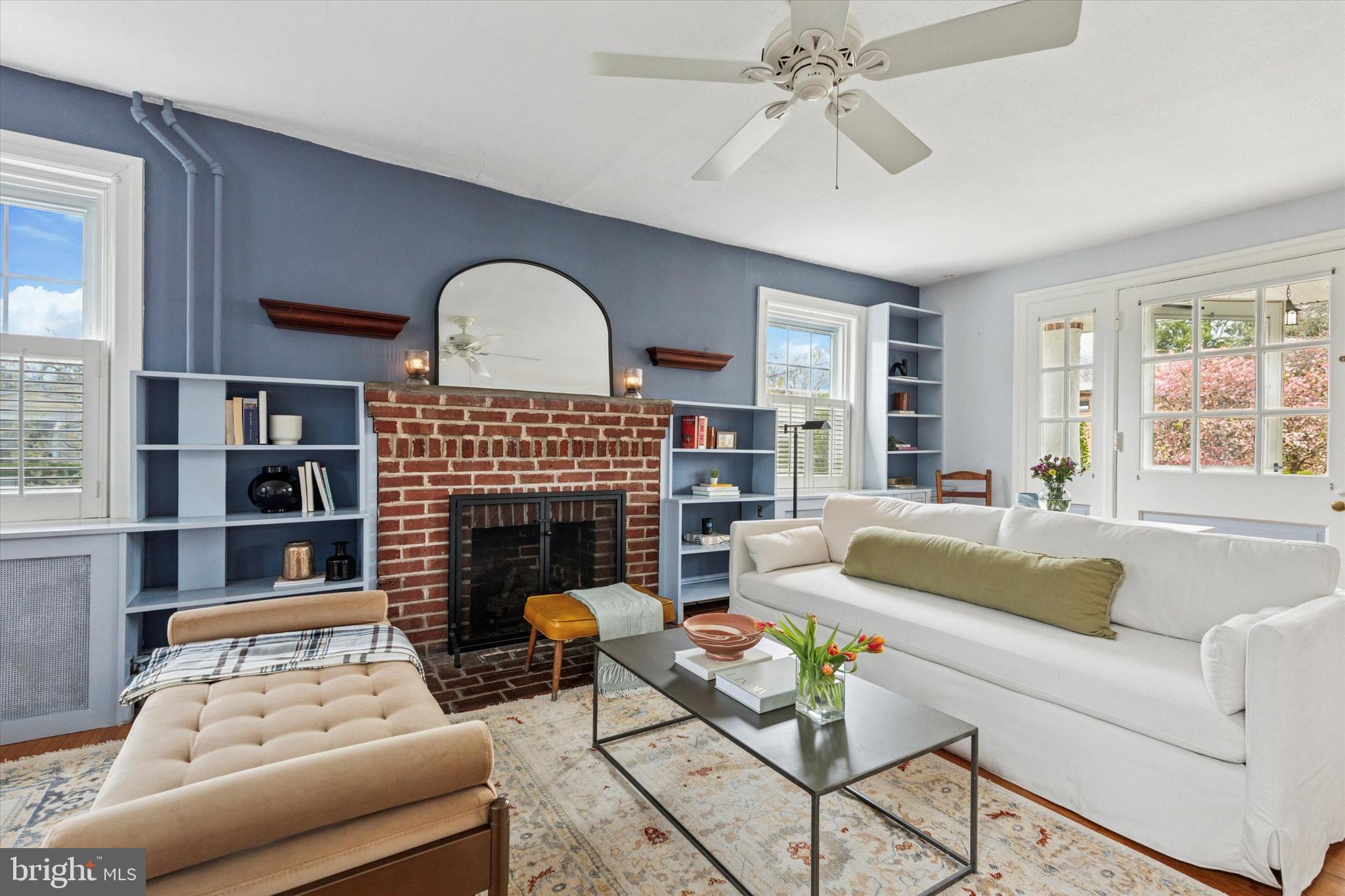 208 Sabine Avenue Narberth, PA 19072 - Photo 8 of 38 a living room with furniture fireplace and a large window