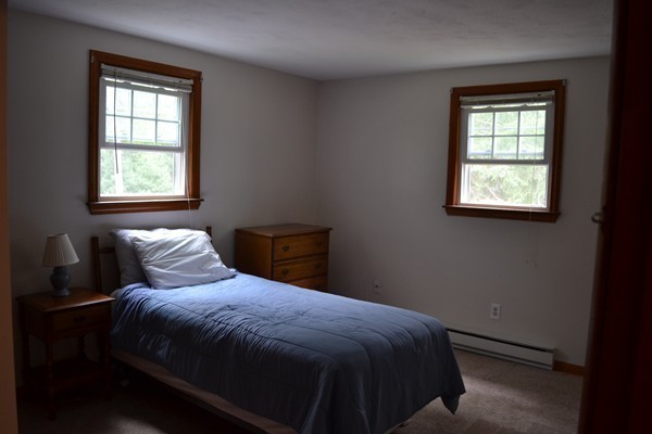 78 Bay Road Easton, MA 02356 - Photo 11 of 30 a bed sitting in a bedroom next to a window
