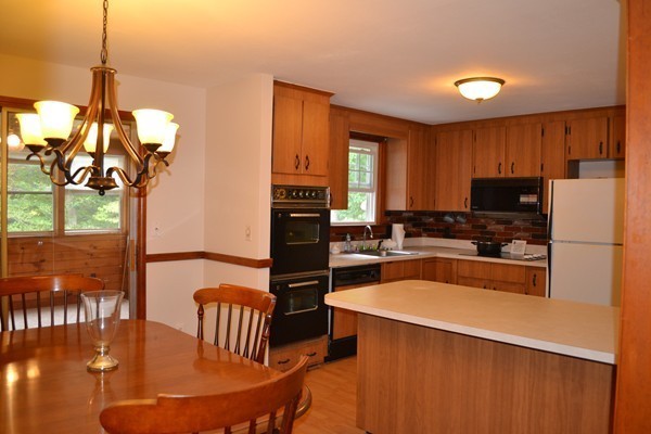 78 Bay Road Easton, MA 02356 - Photo 5 of 30 a kitchen with stainless steel appliances granite countertop a sink a stove and refrigerator